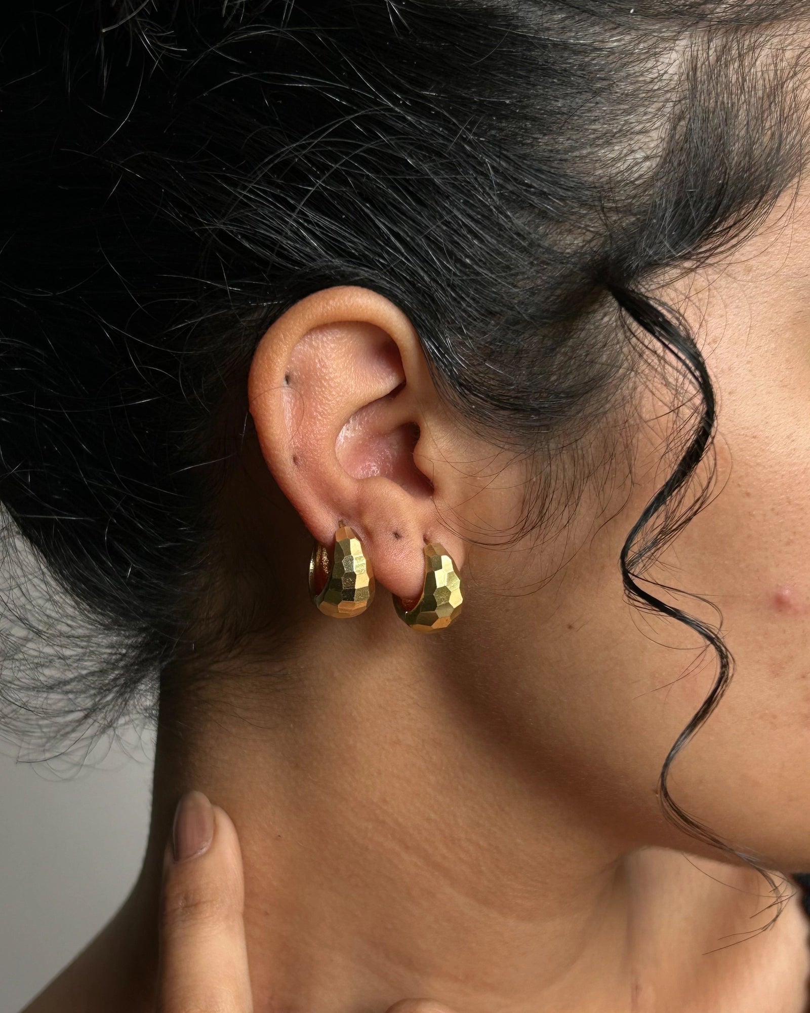 Brass textured hoop earrings handmade by A Creator's Studio