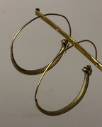 Brass snake hoop earrings handmade by A Creator's Studio