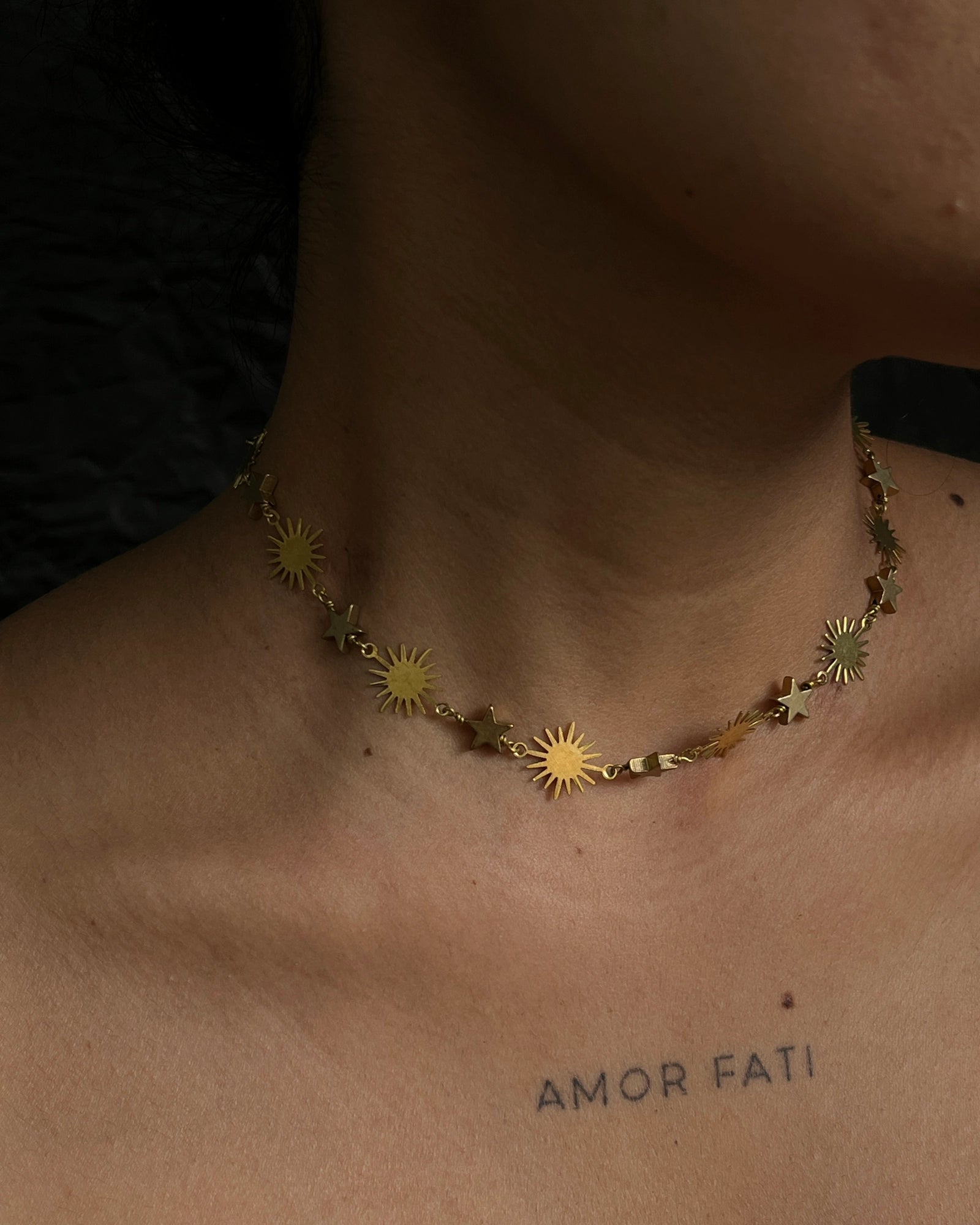 Brass star and sun link necklace with stars and suns linked together handmade by A Creator's Studio