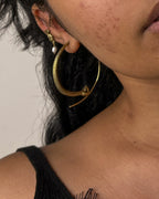 Brass snake hoop earrings handmade by A Creator's Studio