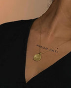 Brass necklace with a hammer texture coin pendant handmade by A Creator's Studio