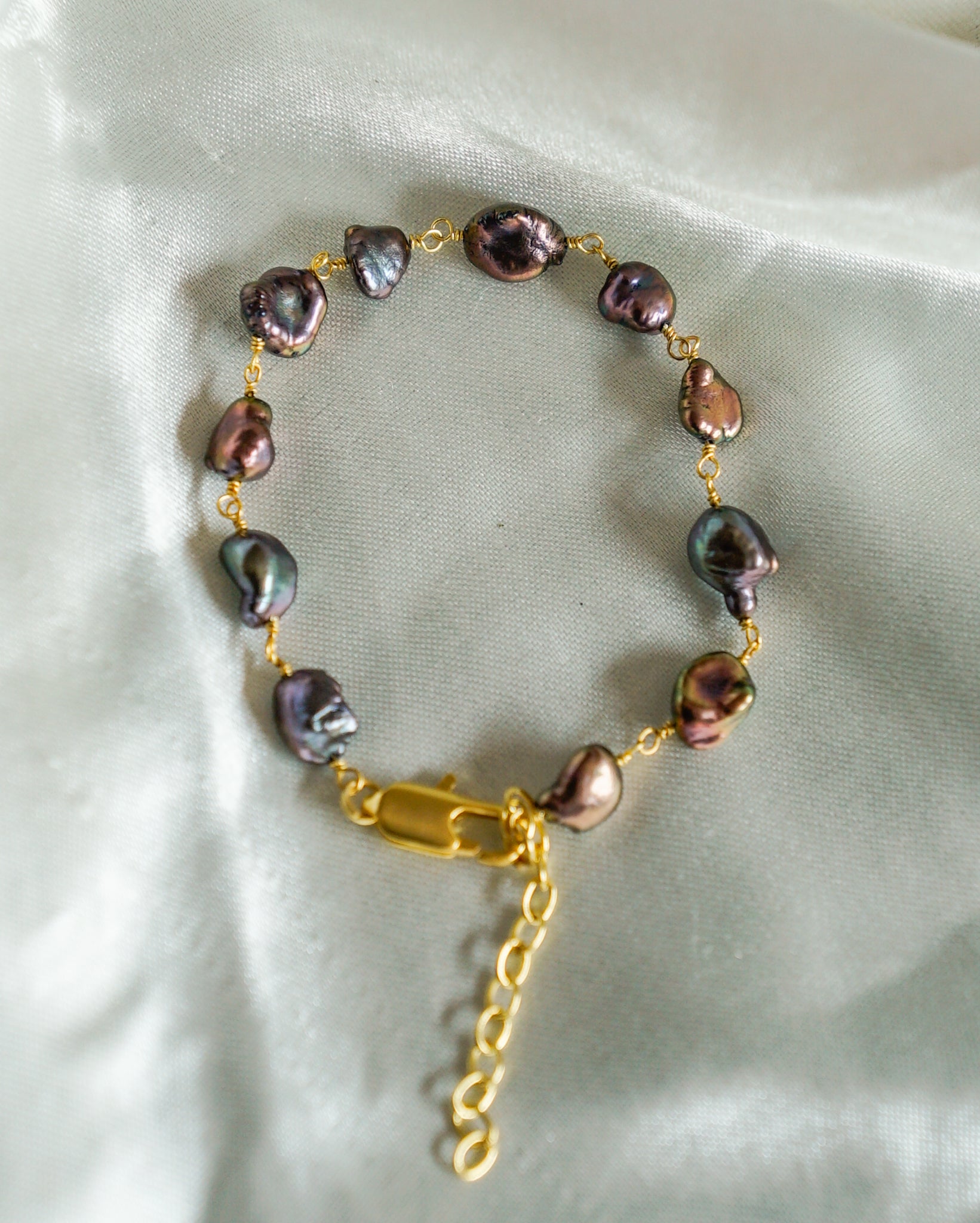 lustrous and Rare Black Fresh Water Pearls linked together in 20k Gold Plated Brass handmade by A Creator's Studio