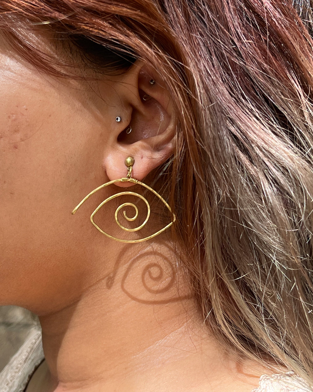 Brass eye earrings handmade by A Creator's Studio