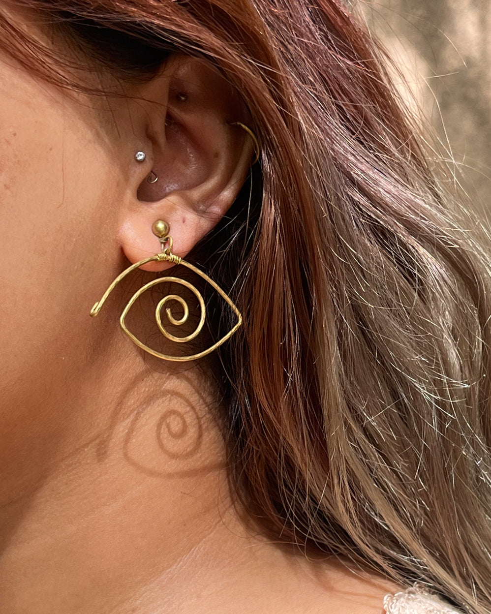 Brass eye earrings handmade by A Creator's Studio