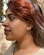 Brass eye earrings handmade by A Creator's Studio