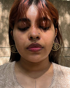 Brass eye earrings handmade by A Creator's Studio