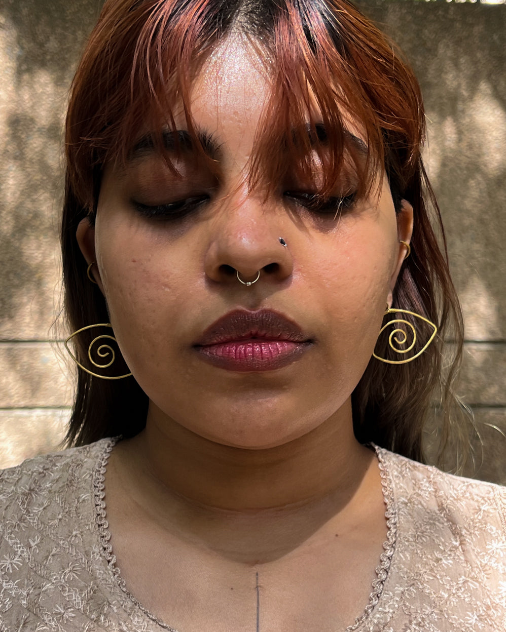 Brass eye earrings handmade by A Creator's Studio